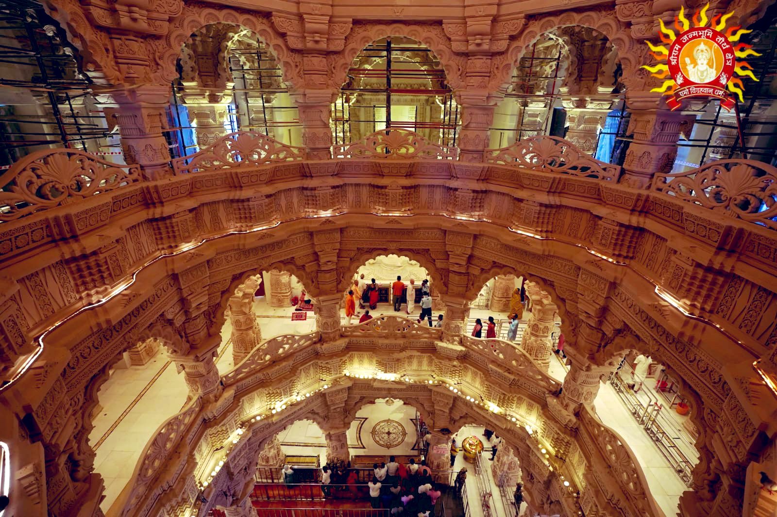 Ram Mandir interior - the magnificent carved stone vaulted ceiling and multiple arched galleries with devotees visible